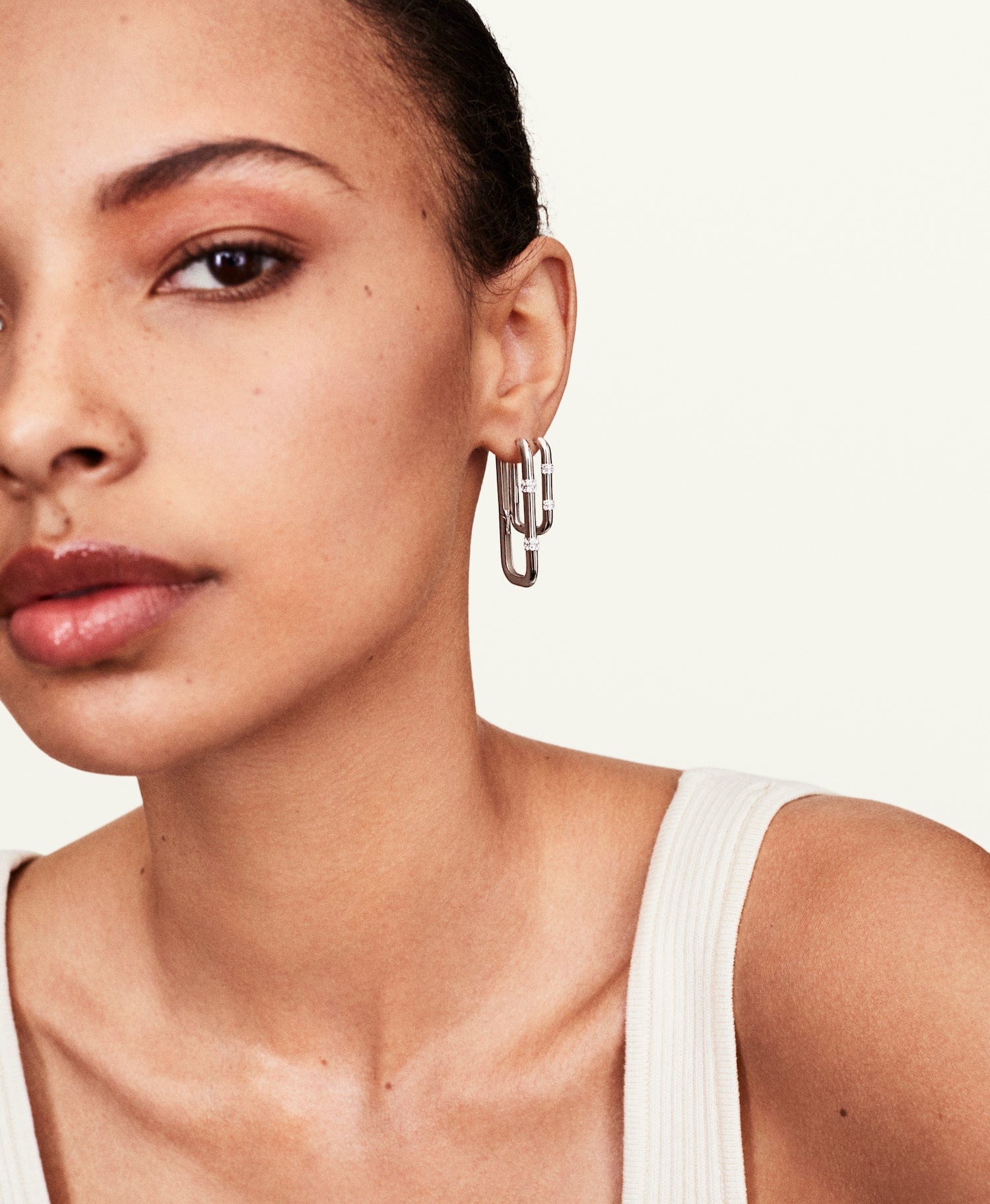 Model wearing double diamond hoops