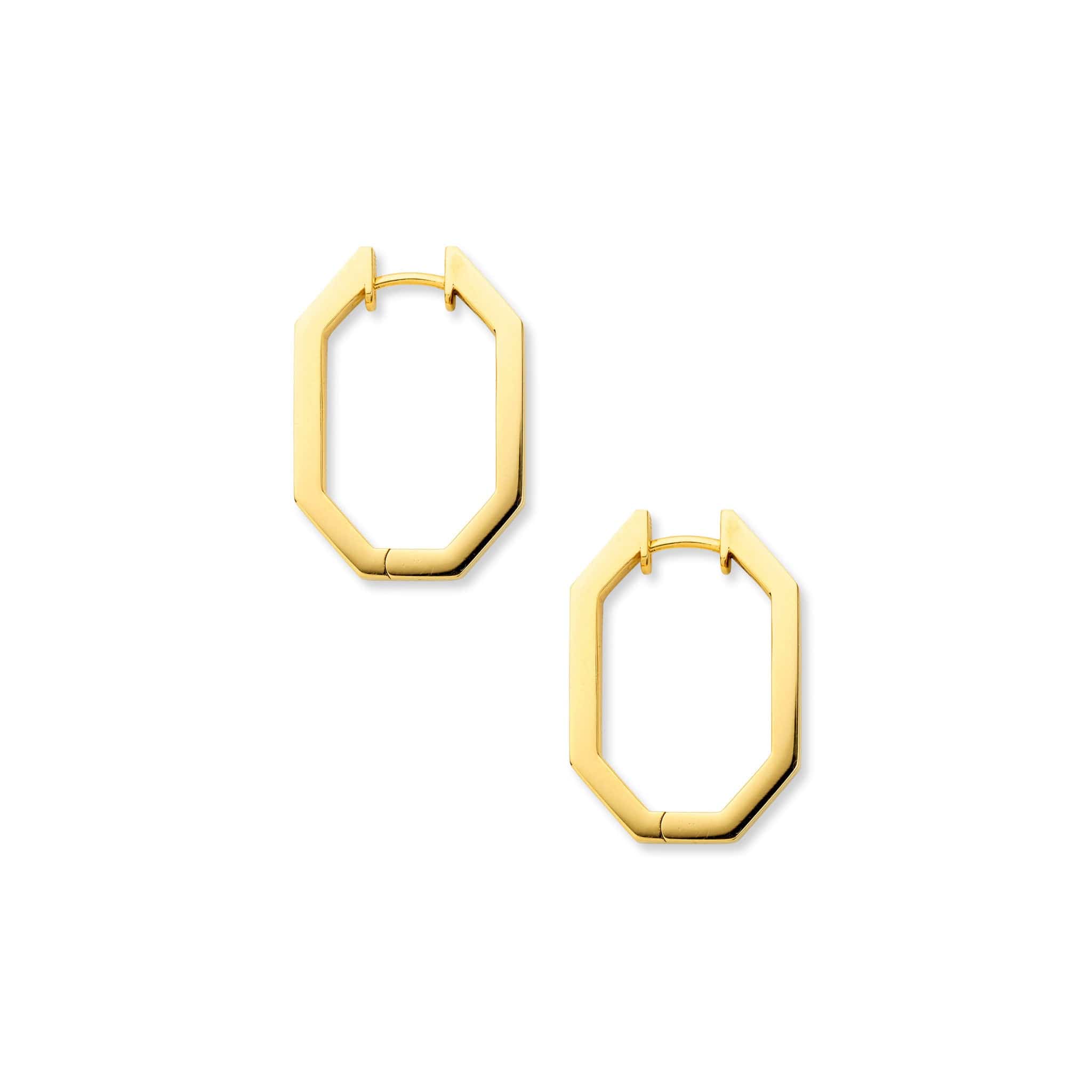 A pair of unique shaped gold octagon hoop earrings lying flat.