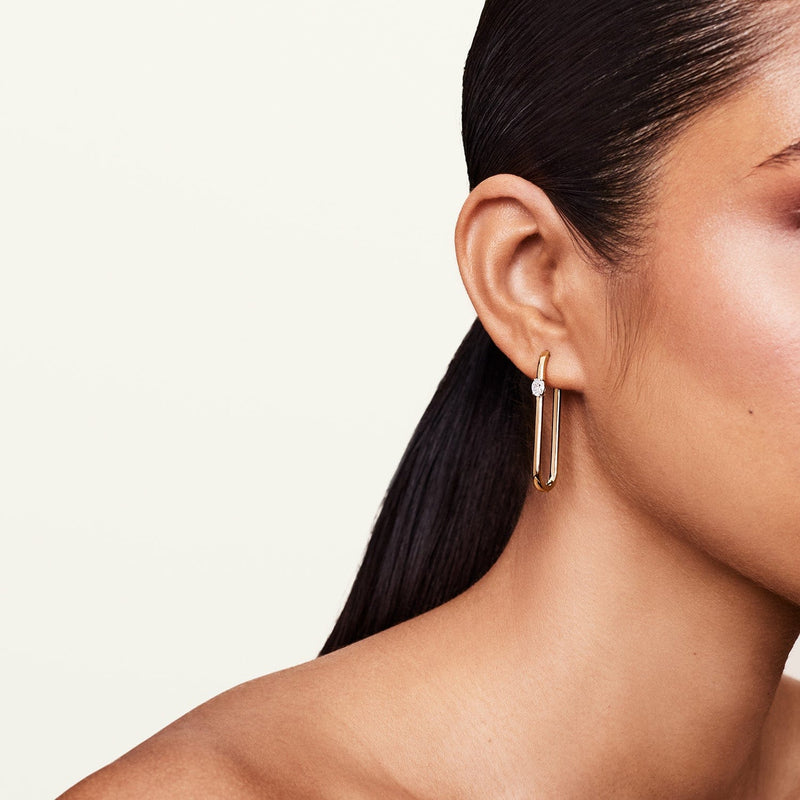 Model showcasing Rumi diamond solitaire earring