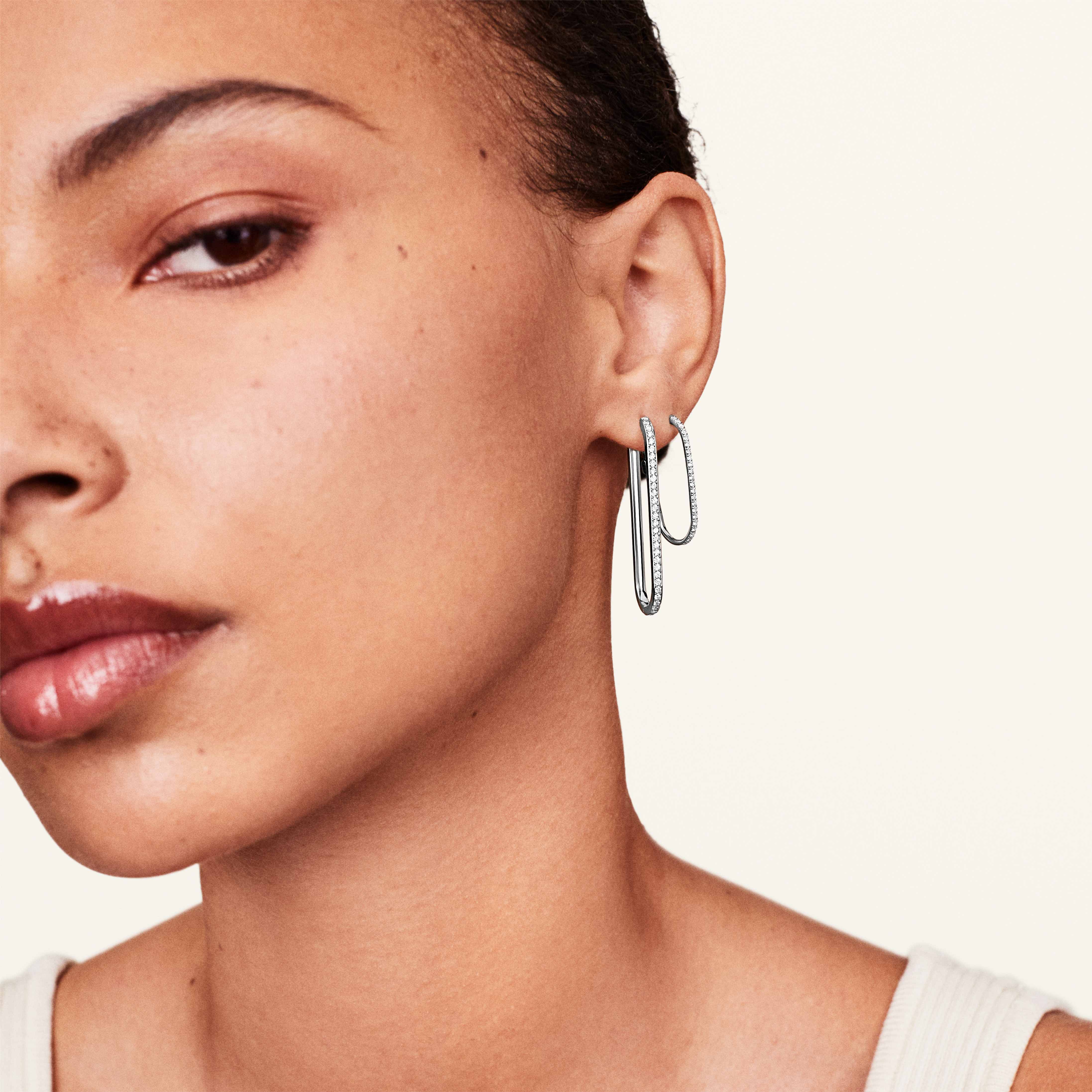 Model showcasing the Rumi diamond rectangle earrings