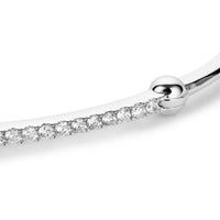 Close up shot of white gold bracelet with diamond bar