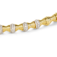 Close up shot of hourglass statement gold bracelet 