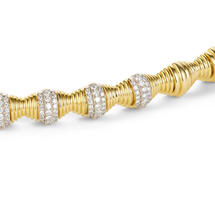 Close up shot of hourglass statement gold bracelet 