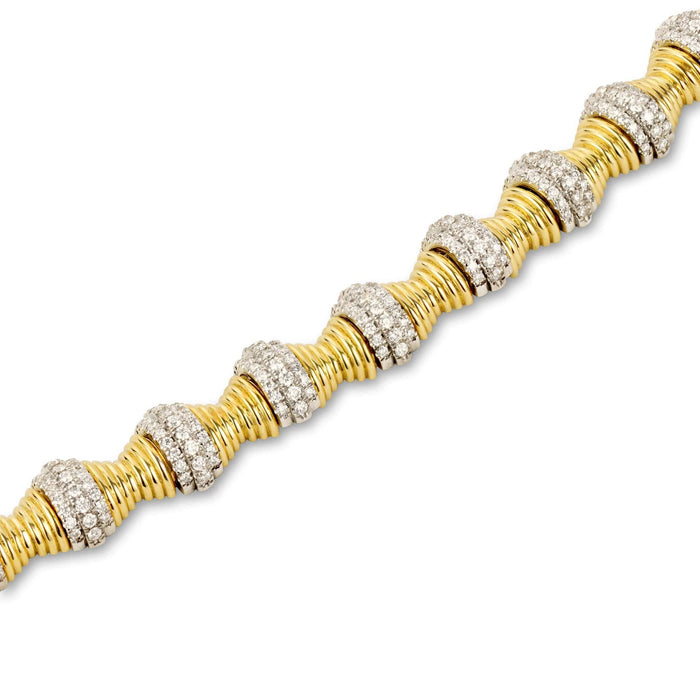 Close up shot of hourglass gold diamond statement necklace specs