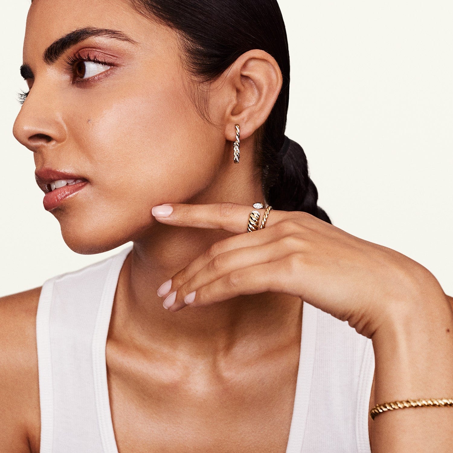 Model wearing diamond cuff ring with matching jewelry