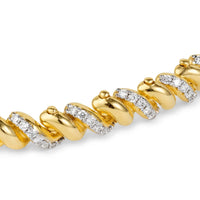 Close up of diamond infinity bracelet yellow gold