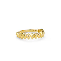 Side view of the elegant gold ring with a leaf-like pattern.