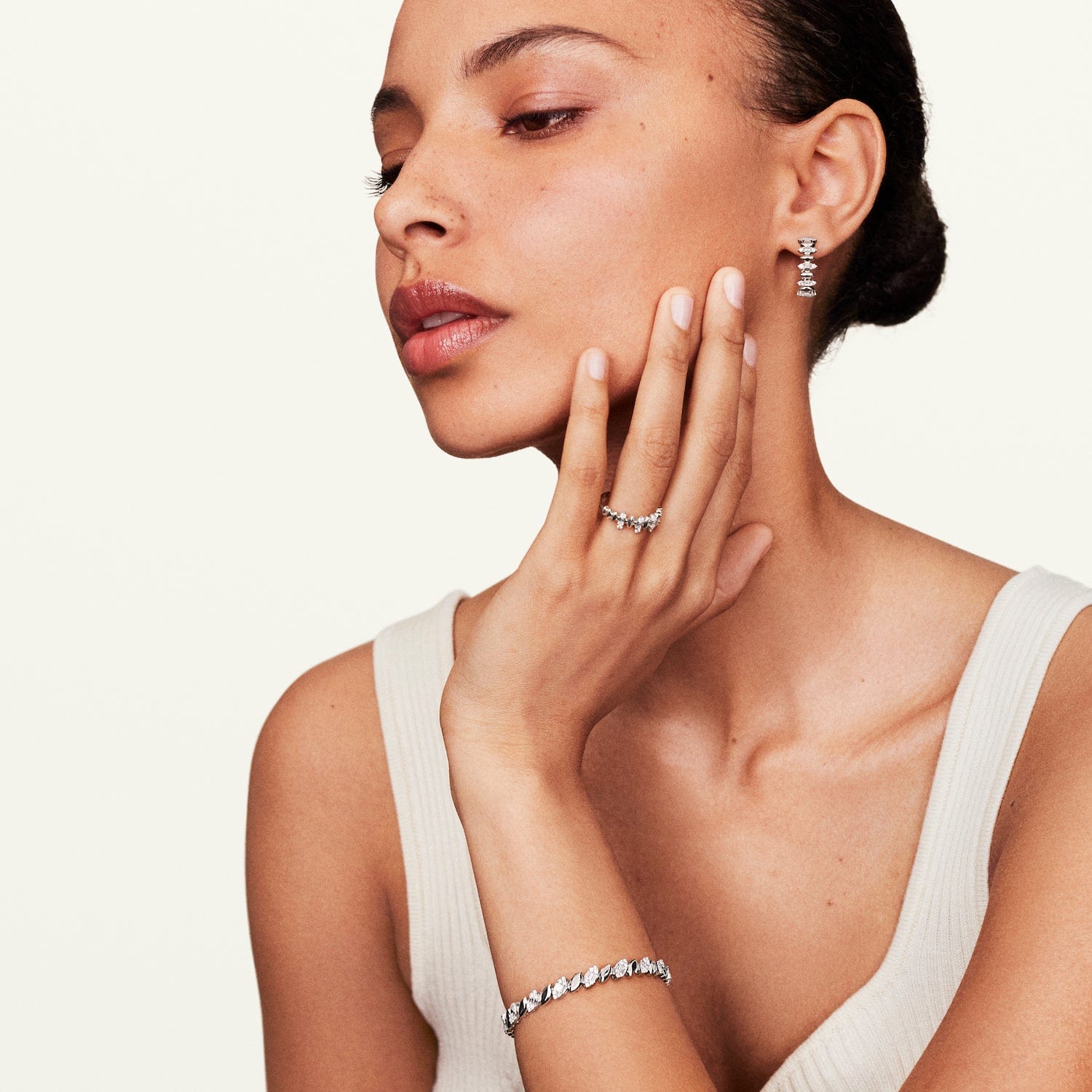 Model wearing diamond hoop earrings white gold 