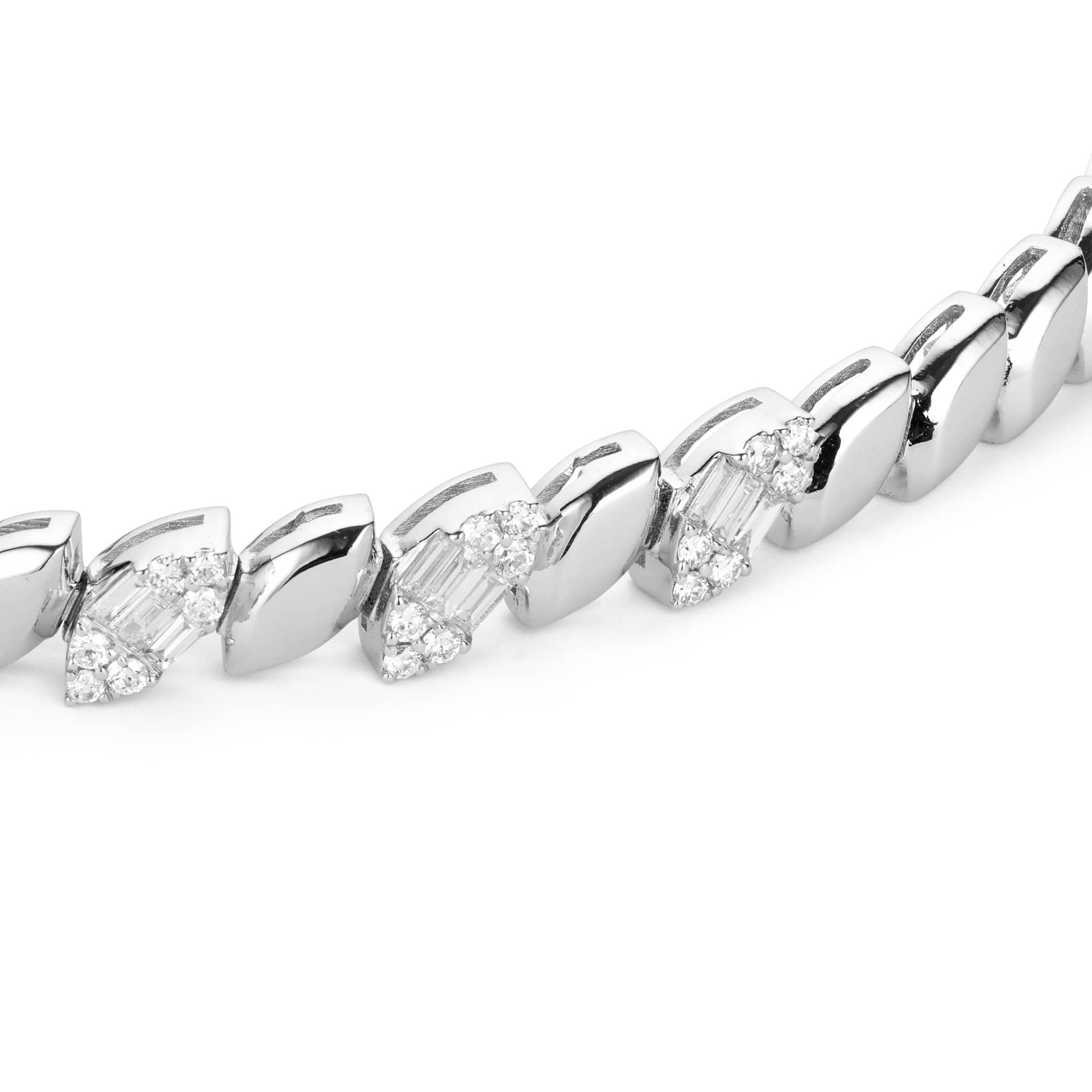 Close up shot of white gold diamond leaf bracelet design